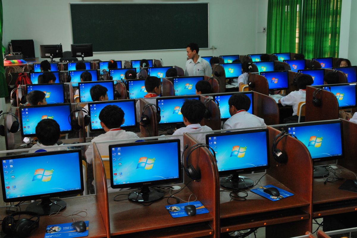 Students learning at desktop computers in a modern computer lab