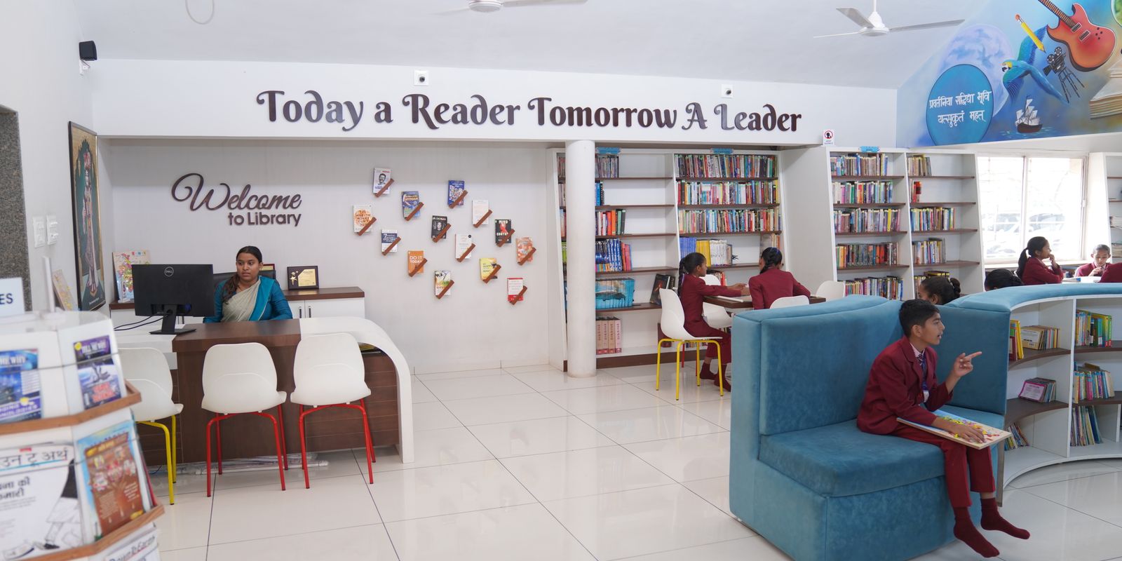 Students studying at tables in the bright Oakwood library