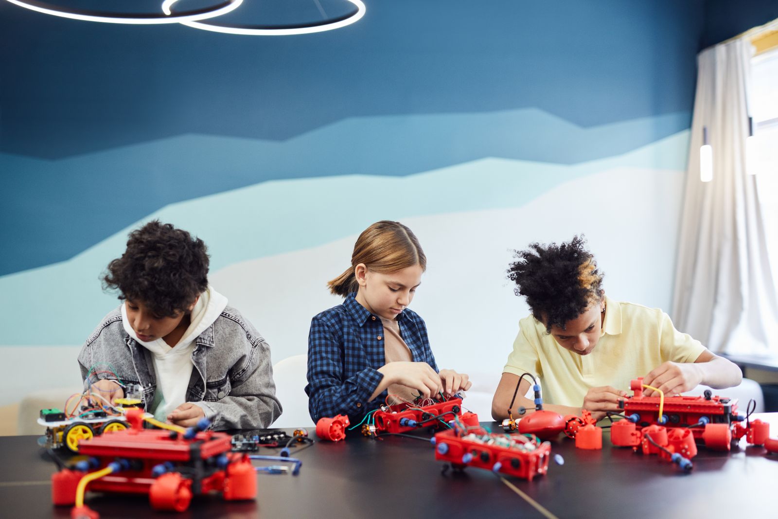 Middle School students working together at a classroom desk
